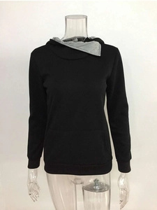 Detail of grey lapel collar and drawstring hood on black long sleeve sweatshirt