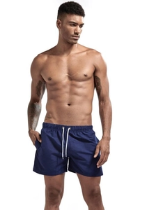 Detail of navy blue swim trunks showing elastic waistband with white drawstring and pockets