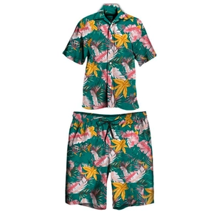 Close-up of tropical floral print on loose-fit Hawaiian summer shirt and shorts set