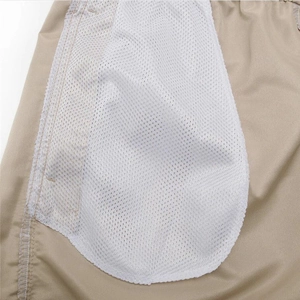 Detail of the quick-dry beach shorts showing breathable white mesh lining and stitching