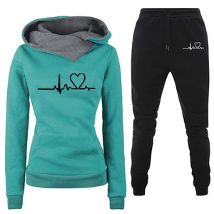 Women's two-piece tracksuit set with green hoodie and black jogger pants featuring heartbeat print