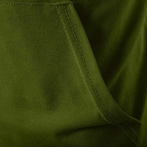 Close-up of double-stitched kangaroo pocket seam on deep green knit hooded t-shirt