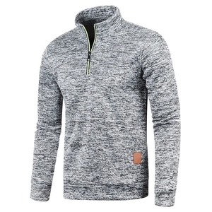 Detail of the 1/4 zipper neckline with neon green trim and premium knitted gray fabric