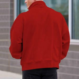 Outdoor shot of men's red fleece sweatshirt with stand collar and ribbed hem details