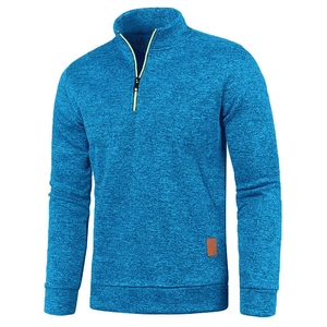 Detail of blue heather half-zip sweatshirt with neon trim and leather patch