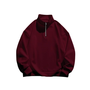 Detail view of the silver half-zipper on a burgundy fleece stand collar sweatshirt for men