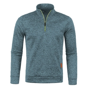 Detail of grey-blue knit sweater showing stand collar and fluorescent yellow zipper