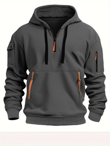 Detail view of men's dark gray tactical hoodie featuring orange zippers and arm pockets