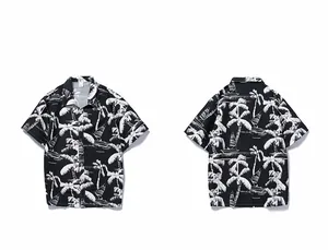 Front and back view of men's black tropical Hawaiian shirt with white coconut tree prints