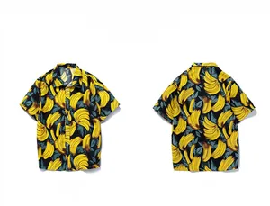 Flat lay of Hawaiian shirt with vibrant yellow banana pattern on black background