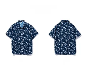 Front and back view of men's navy blue Hawaiian shirt featuring white palm tree prints