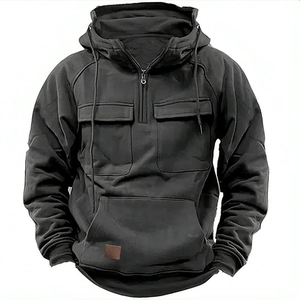 Close-up of tactical hoodie featuring double chest flap pockets and a half-zip neckline