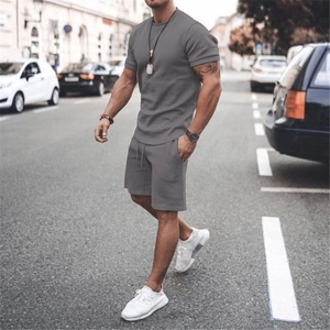 Close-up of gray knit fabric texture and seam detail on men's summer sports set