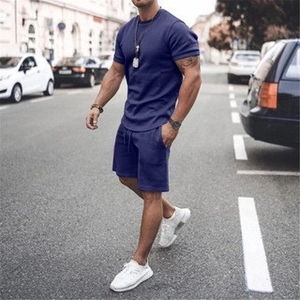 Street view of men's navy blue casual short set with crewneck t-shirt and drawstring shorts