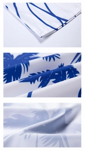 Close-up of tropical blue coconut tree print on lightweight white summer shirt fabric