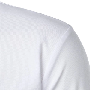 Detailed macro view of white piqué knit fabric texture and shoulder seam on a polo shirt