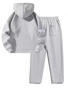 Detailed flat lay of women's grey knitted cotton tracksuit featuring hooded sweatshirt and joggers