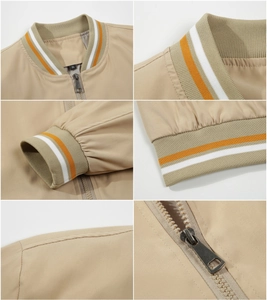 Detail view of khaki bomber jacket featuring orange striped ribbed cuffs and collar texture