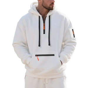 Detail of men's white hoodie showing black half-zip collar and orange zipper puller accent