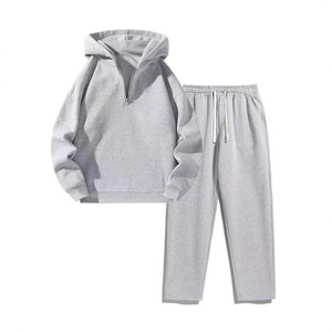 Women's two-piece light grey tracksuit with half-zip hoodie and wide-leg joggers