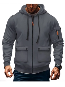 Detailed view of cargo hoodie with large flap pockets and orange zipper details