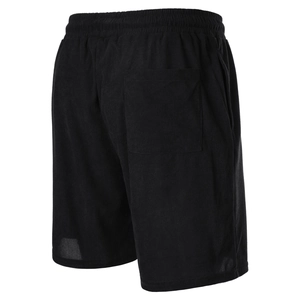 Detail of black corduroy shorts showing textured fabric and elastic waist with back pocket