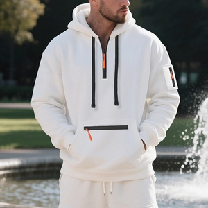 White heavy fleece hoodie featuring half-zip neck with orange pull and arm pocket detail