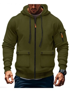 Detail of olive green tactical hoodie featuring zip pockets and ribbed cuffs texture