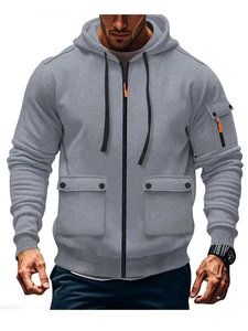 Detail of grey men hoodie with utility pockets, central zipper and orange puller detail