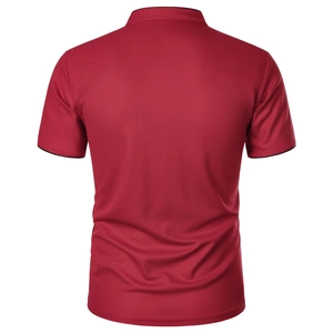 Detail of slim-fit red mesh polo shirt featuring stylish black contrast collar and cuffs