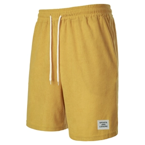 Detail of yellow corduroy shorts featuring elastic waistband and white drawstring cord
