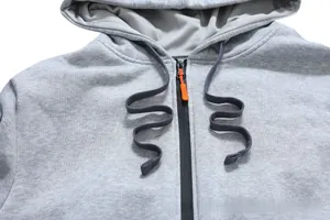 Detail of grey hoodie showing drawstring collar and black zipper with orange puller