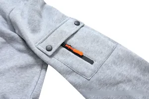 Detail view of light grey hoodie sleeve with functional cargo pocket and orange zipper puller