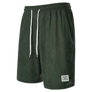 Close-up of green corduroy texture and white drawstring on men's casual shorts