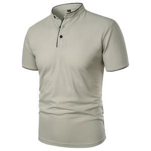 Detail of slim fit beige polo shirt with black contrast trim and three buttons
