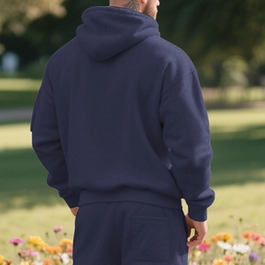 Rear view of heavy fleece navy blue hoodie and shorts set worn outdoors