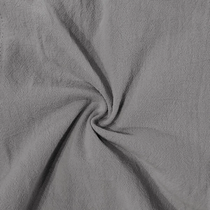 Vista detallada de la textura de la tela de lino gris con patrón tejido transpirable
