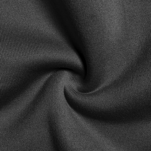 Vista macro di tessuto a maglia nera ad alta densità con texture fine ed elasticità