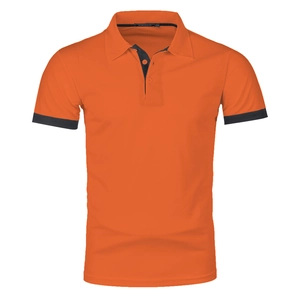 Detail of orange polo shirt showing dark blue contrast collar and sleeve trim