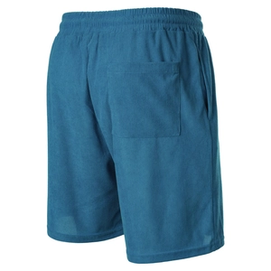 Detail view of peacock blue corduroy shorts showing textured fabric and drawstring waist