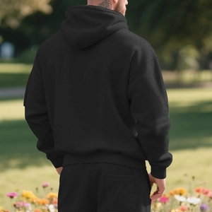Back view of heavy fleece-lined black hoodie set with ribbed cuffs and casual fit
