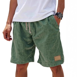 Men's sage green linen blend summer shorts with drawstring waist and leather patch detail