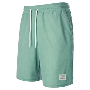 Detail of mint green corduroy shorts showing textured fabric and drawstring waist