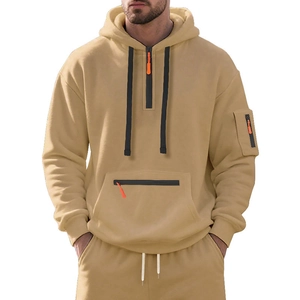 Detail of sand yellow men's heavy hoodie with functional quarter zip and sleeve pocket