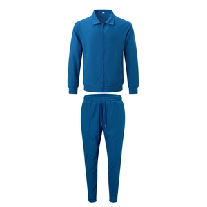 Close-up of dark blue waffle knit tracksuit jacket with zip pocket and drawstring pants