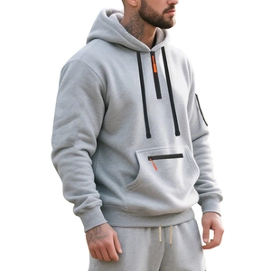 Detail of grey hoodie showing neck half-zip with orange puller and waterproof pocket zippers