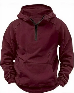 Detail view of burgundy men's hoodie featuring quarter-zip collar and kangaroo pocket