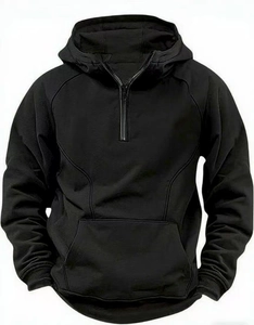 Detail of black hooded sweatshirt featuring a half-zip neckline and spacious kangaroo pocket