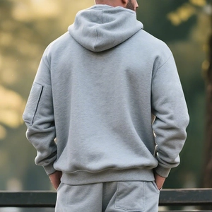 Detail of grey heavy fleece hoodie set showing sleeve pocket and back view cut