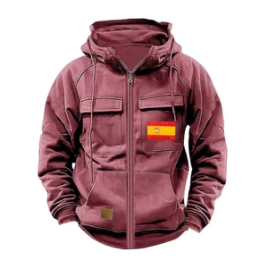 Detail of burgundy zip-up hoodie featuring Spanish flag patch and flap chest pockets